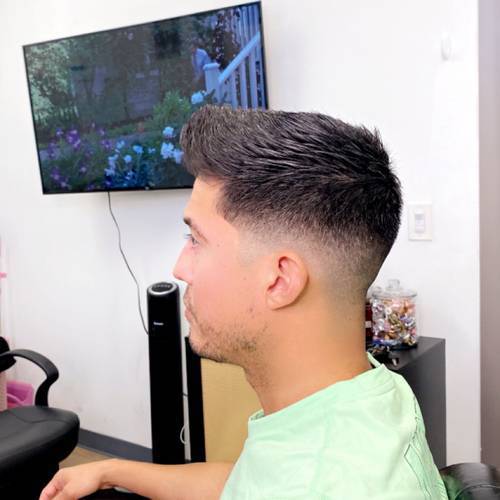 Styled men’s haircut with a clean fade